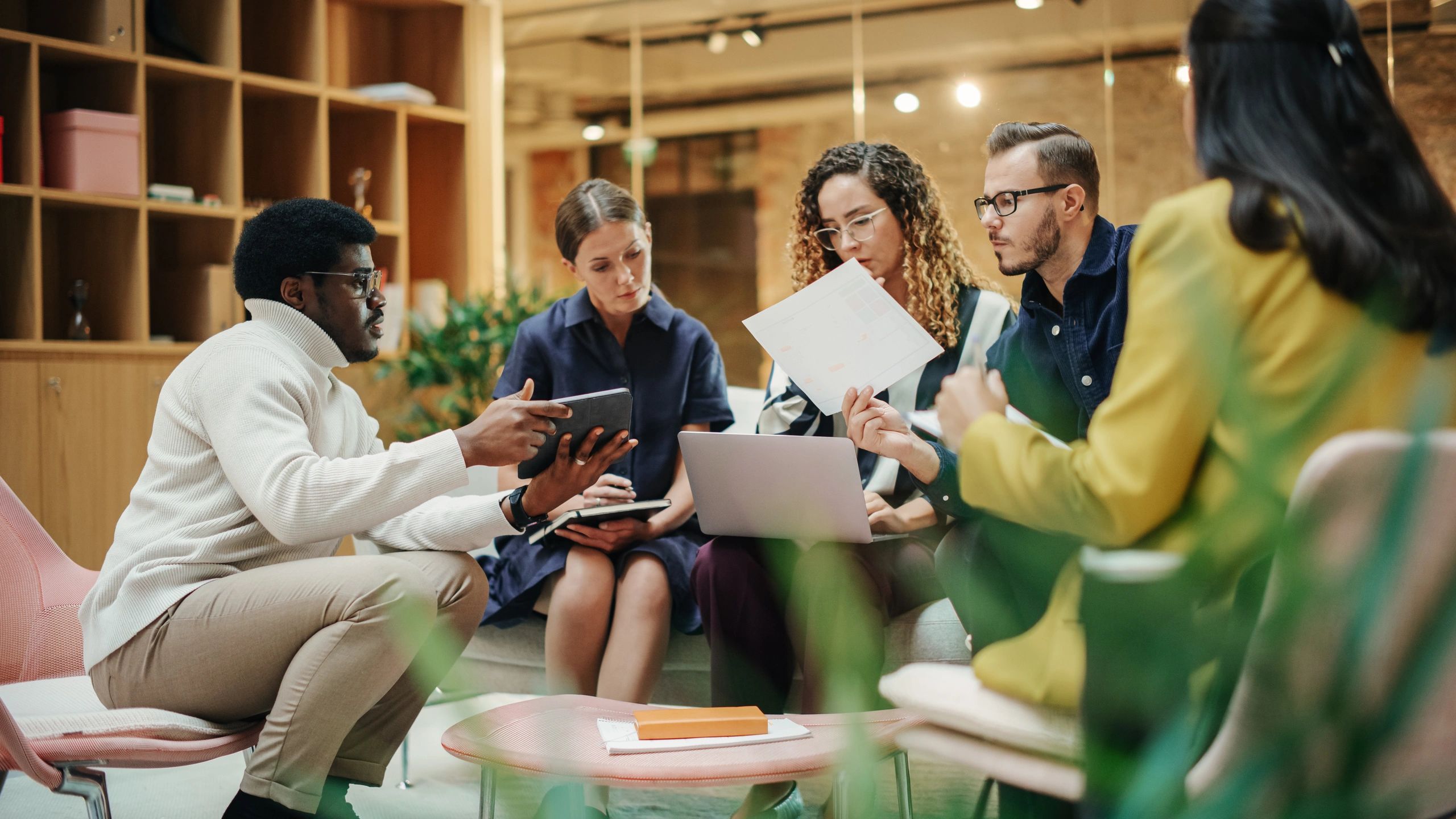 Finance team meeting with clients in a modern office
